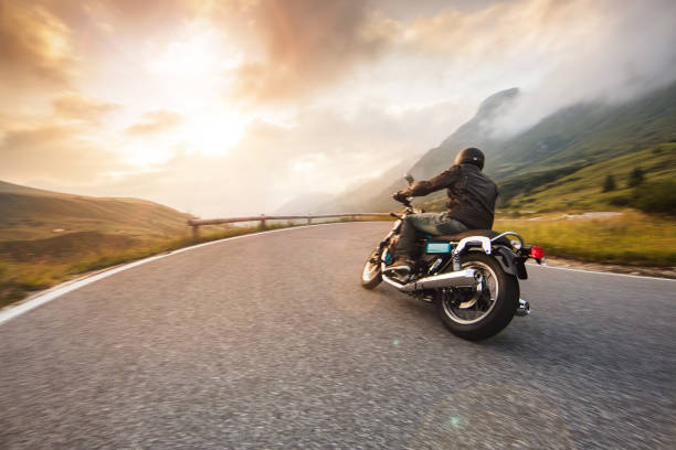 Motorcycle Driver Riding In Dolomite Pass, Italy, South Europe.